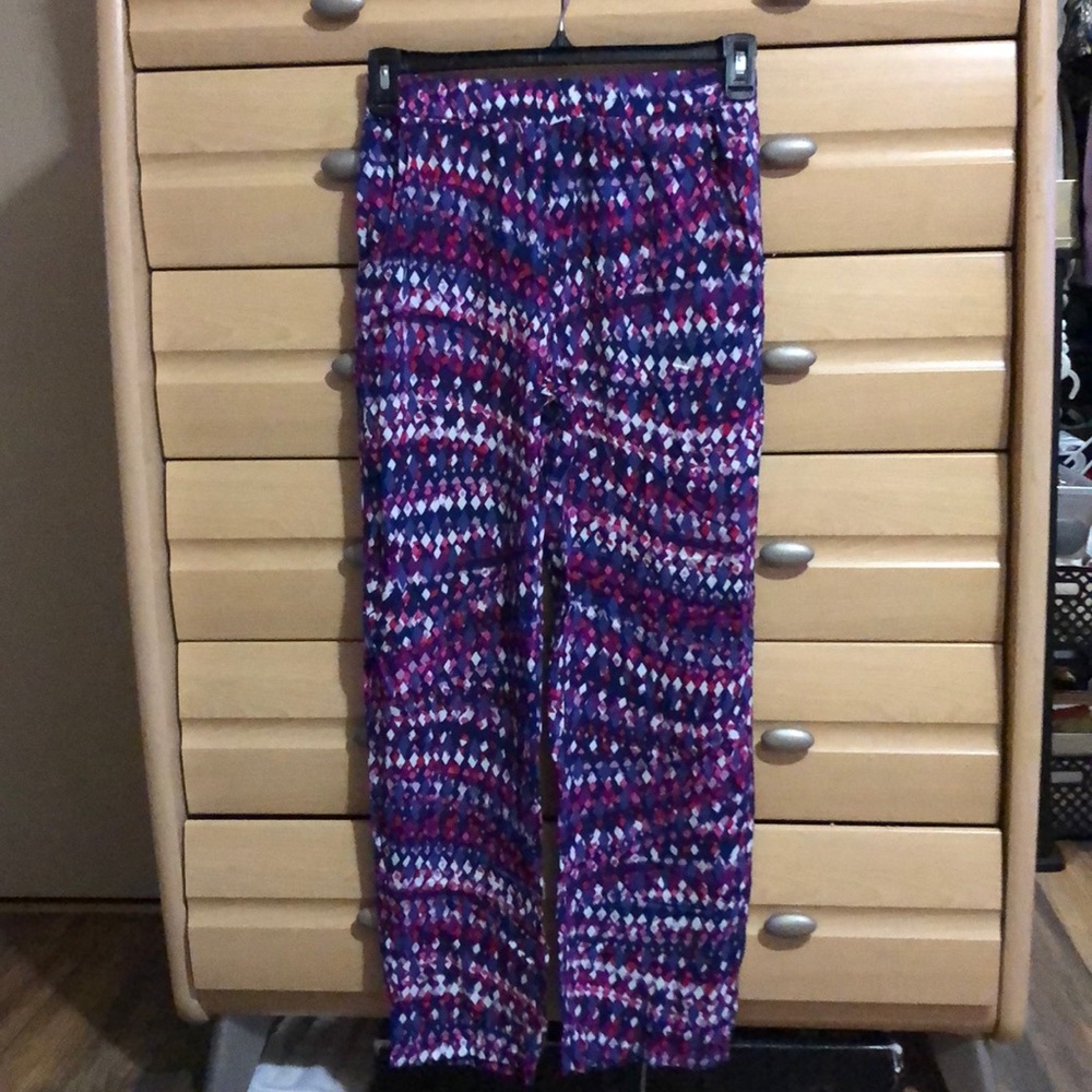 Used colorful design pants with side pockets.